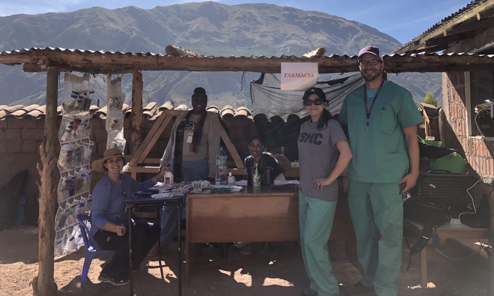 A group of nurses pose outdoors in Peru.