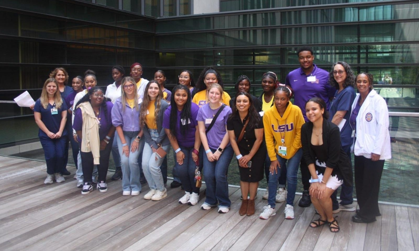 New nursing students work together on an anatomy simulation table.
