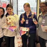 School of Nursing students (from left to right) Ainsley Embley, Taelor Foret, Leah Gill and Darren Dison attended the PALS Resource Fair on February 18, 2025, displaying materials they received from various campus resource providers.